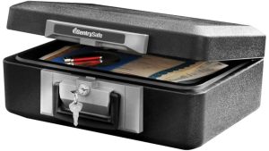 SentrySafe fireproof and waterproof document safe box open, showing papers and pens stored inside, with keys in the lock — UK Prepper Hub
