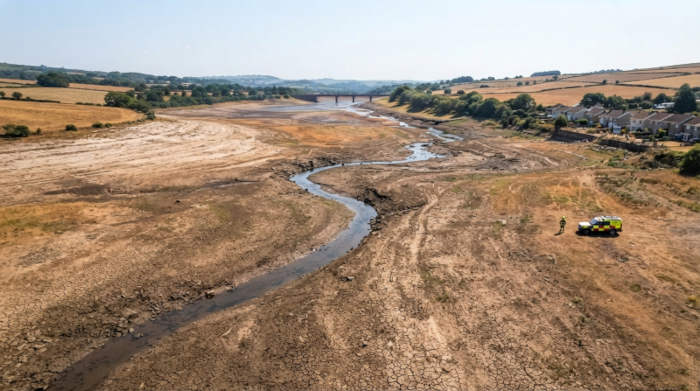 Moorland Fires Have Burned 18,600 Hectares This Year — And Britain's Fire Service Is Running on Empty | UK Prepper Hub Aerial view of a dried reservoir bed, showing how low water levels are during wildfire season